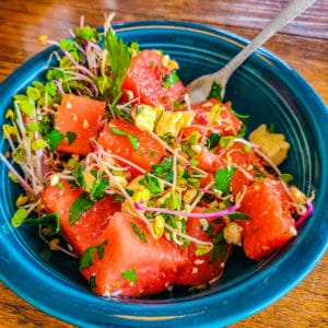 Fruit salad with a twist! Watermelon with zesty radish sprouts and savory cotija cheese round out this unique summer salad