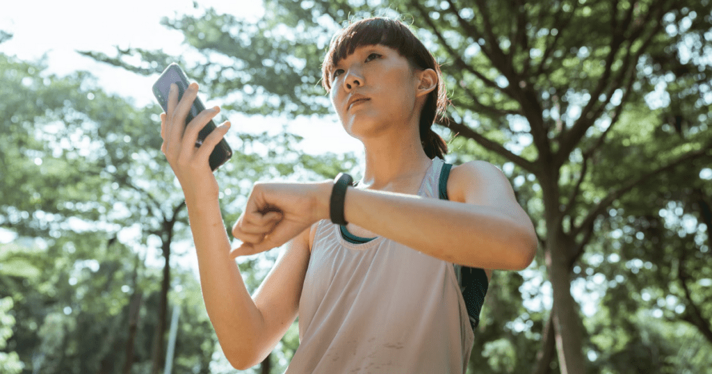 woman checking her fitness and food tracking apps