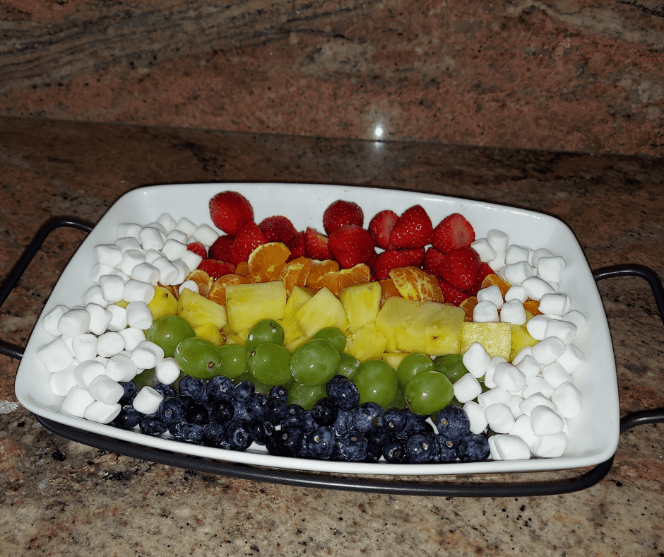 A rainbow fruit tray along with St Patricks Day Pancakes is sure to bring good luck
