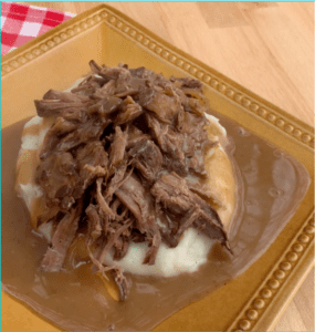 Shredded beef in slow cooker made from sirloin tip roast is perfect for a family meal or meal prep