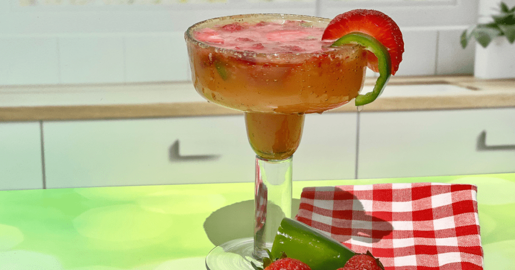 Non-alcoholic margarita mocktail idea garnished with a fresh jalapeno