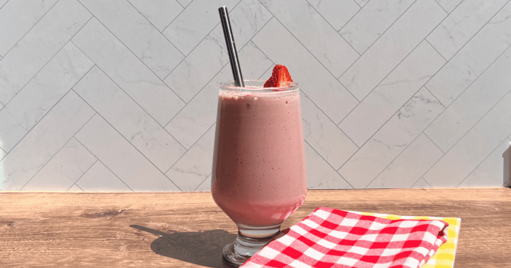 This rhubarb strawberry smoothie recipe is a protein packed supershake that tastes like kuchen!