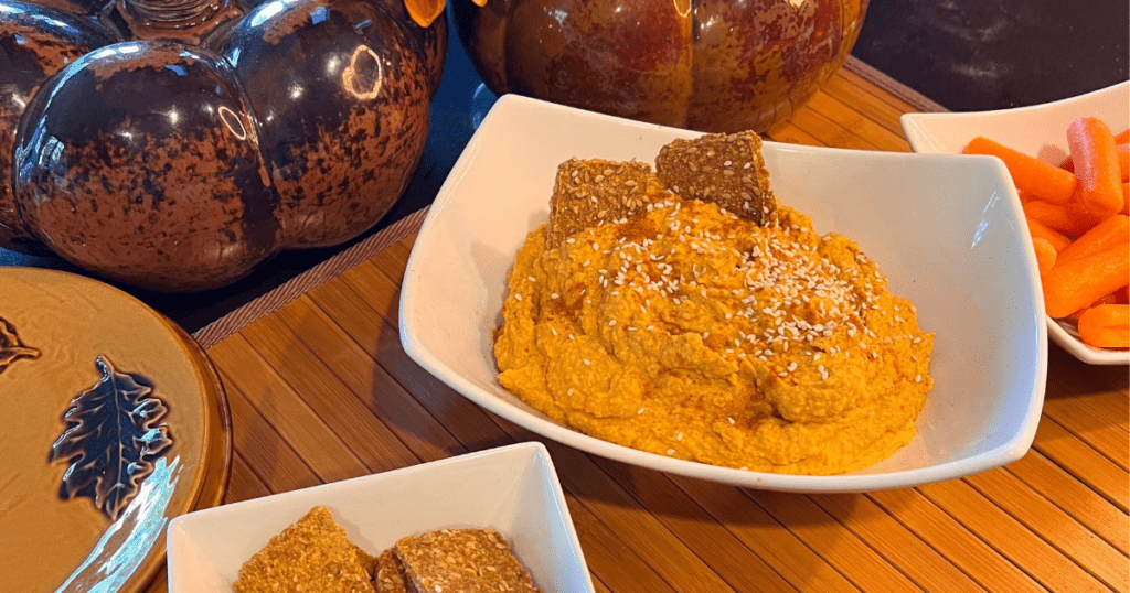 What to eat with pumpkin hummus: carrots, pita chips, and even apples pair well with spicy pumpkin dip.