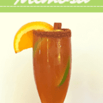 Recipe for a holiday mocktail: Cinnamon Apple Cider Mimosa with a spiced rim