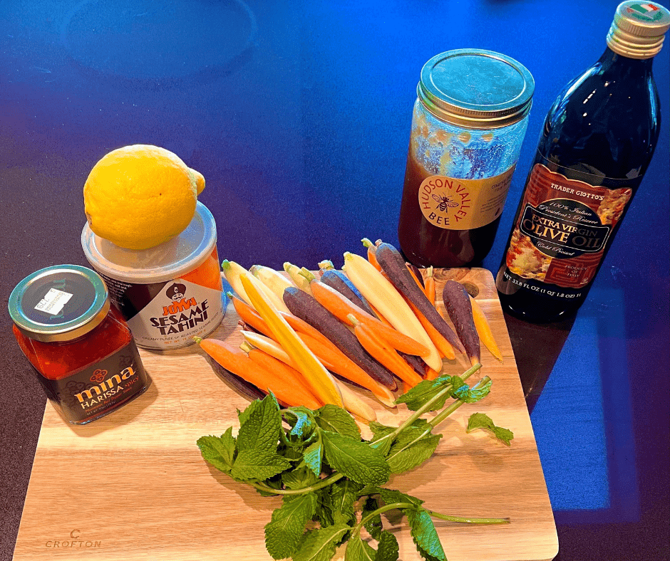 What is harissa? Ingredients for roasting carrots in harissa sauce topped with a easy lemon tahini dressing, garnished with mint