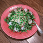 Spring pea salad recipe made with spicy baby arugula and crisp sliced radish