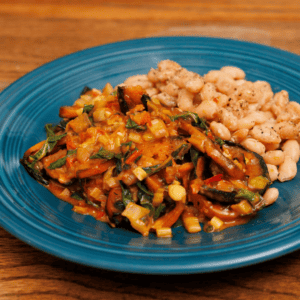 Sauteed butternut squash in harissa sauce. The spicy, tangy elements pair well with creamy canary beans. One skillet dinner