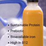 Bottle filled with orange carrot smoothie made with cricket protein powder. Text overlay bulletpoints: “Sustainable protein, prebiotic, bioavailable iron, high in B12, Mild nutty flavor”