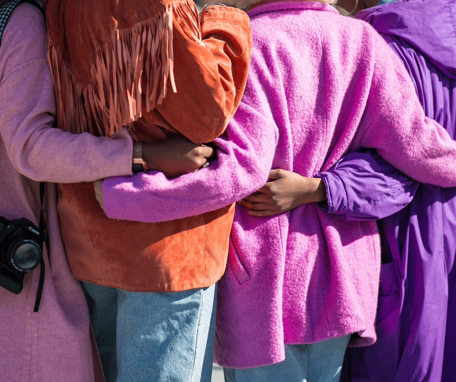 Friends in colorful jackets embody a positive approach to joyful movement, turning exercise into a choice, not a chore.