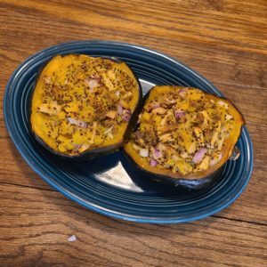 Platter of Roasted Acorn Squash stuffed with vegan fillings