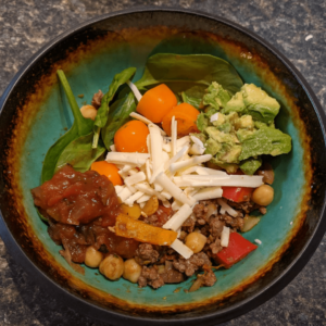 Build your own perfect taco bowl with unlimited toppings from a homemade taco bar