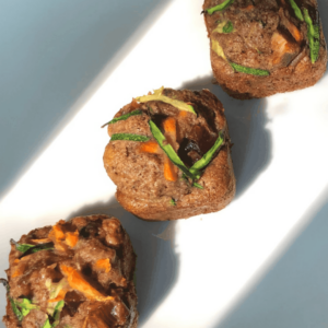 Three mini zucchini carrot muffins made with cricket protein powder.