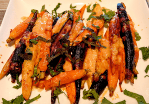 Are carrots good for your eyes? Yes, and here’s a recipe for harissa roasted carrots so good everyone will ask for seconds
