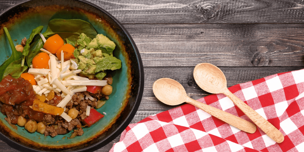 Satisfy everyone with a taco bar. Why limit your toppings, build a deconstructed taco in a bowl.