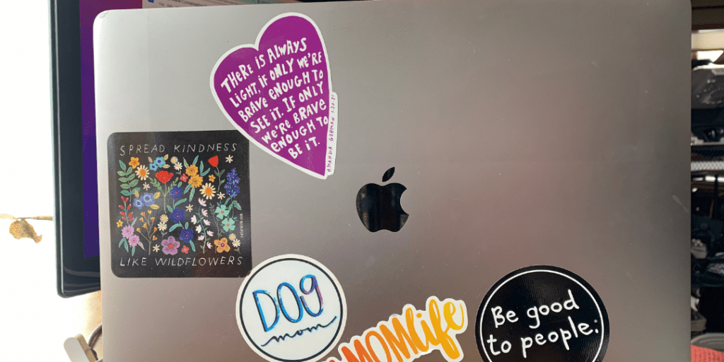 Stickers on the back of a laptop are a wonderful conversation starter to meet new people in your neighborhood