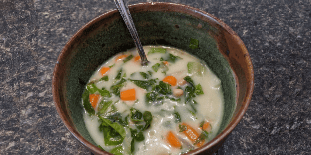 Homemade recipe for Tuscan white bean soup with spinach, potatoes, and carrots. Quick to make with Instant pot